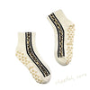 Healing Heels Cheetah Core Cream crew grip socks with black cheetah stripes
