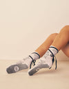 Lucky Honey Nina Spellbound white crew grip socks with black spiderwebs and ballet ties