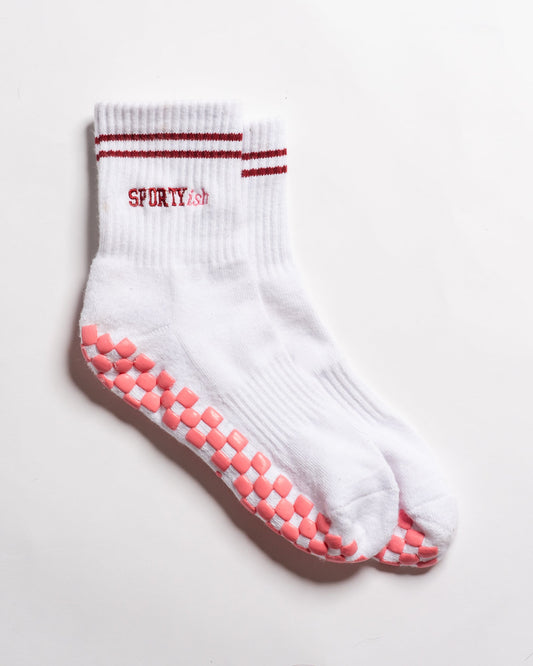 Revel Athletic Sportyish white crew grip socks with burgundy stripes and embroidery and pink GripGrid soles