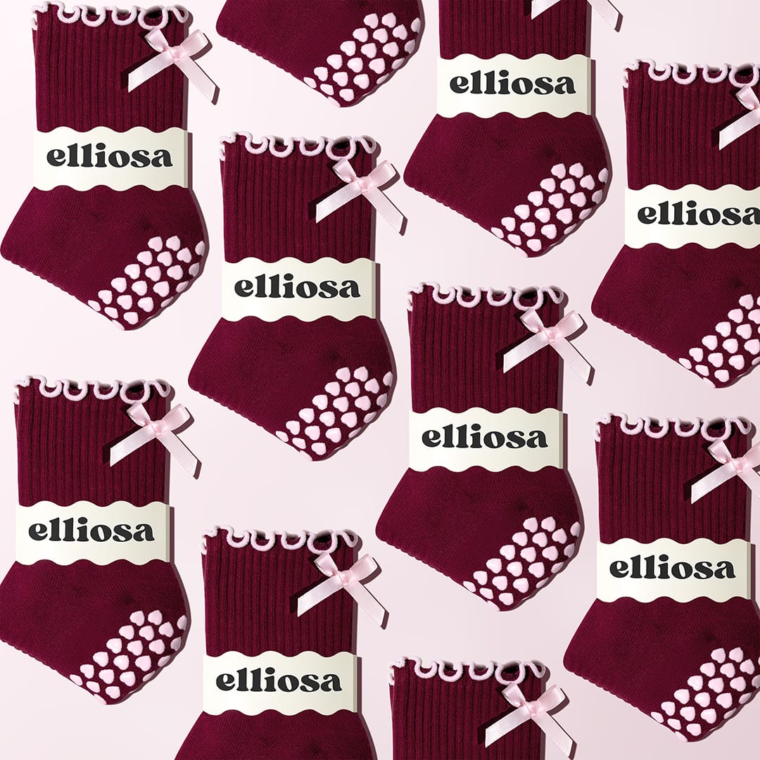 Ribbed fabric and pink bow detail on Elliosa Bordeaux Bow grip socks