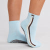 Souls Track Star powder-blue and chocolate grip socks worn with soles visible
