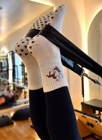 Howdy Pilates socks showing chocolate-brown heart-shaped silicone grips