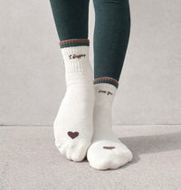 I Gripping Love You socks showing embroidered toe hearts and green sole grips