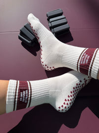 DND grip socks showing burgundy heart-shaped silicone sole grips