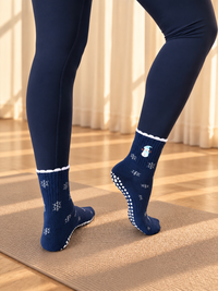 Pilates People Winter Wonderland dark blue grip socks with snowflakes, snowmen and white scalloped cuff — view 3