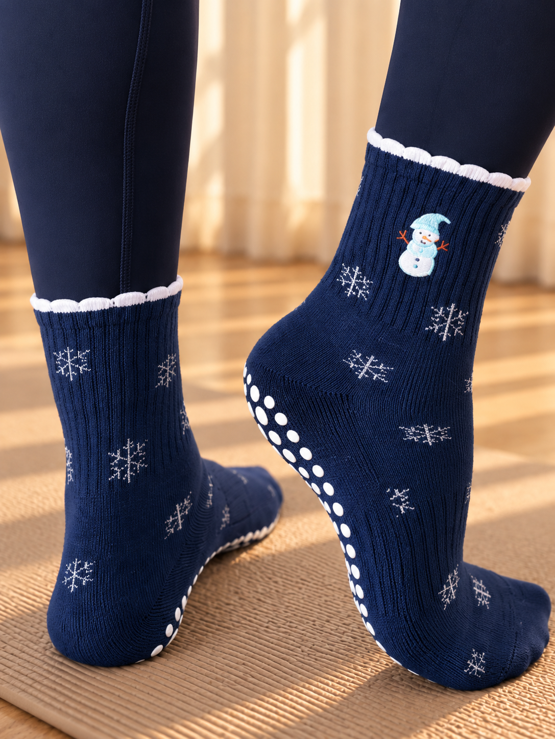 Pilates People Winter Wonderland dark blue grip socks with snowflakes, snowmen and white scalloped cuff — view 5
