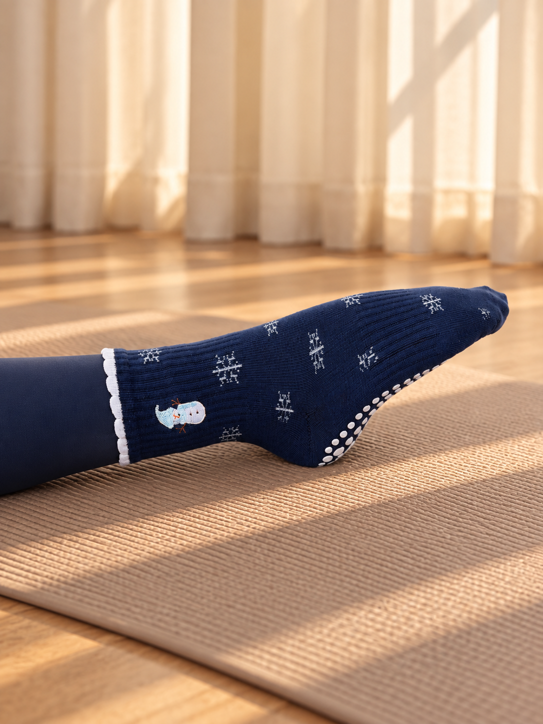 Pilates People Winter Wonderland dark blue grip socks with snowflakes, snowmen and white scalloped cuff — view 6