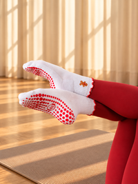 Pilates People Christmas Cheer white grip socks with festive embroidery and red scalloped cuff — view 5
