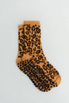 The Core Club Brown Cheetah crew grip socks with caramel, black and rust animal print