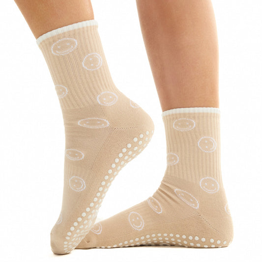 Beige Smiley Grip Socks worn with a neutral studio outfit