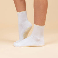 Maison Joie Muse white short-crew grip socks with yellow scalloped cuff and yellow grips