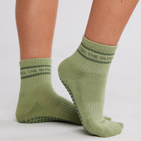 Feel The Burn Grip Socks in olive green front view