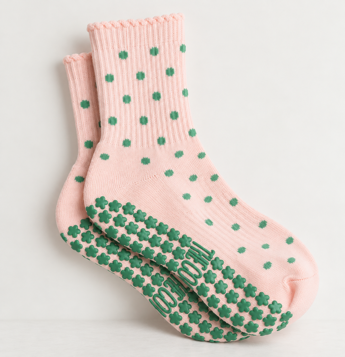 Pink and green polka dot Pilates sock lifestyle view