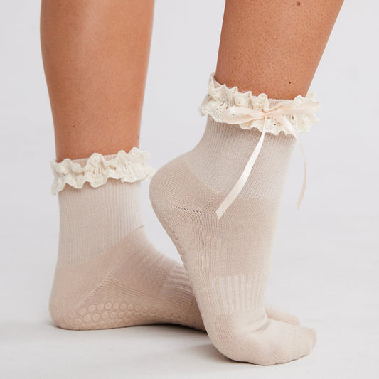 Lace Me Up Grip Socks with white lace bows front view