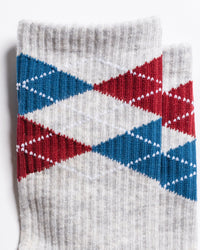 Close-up of The Legacy grey, navy and burgundy argyle grip socks