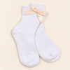 Maison Joie The Signature Peach white grip socks with peach satin bows