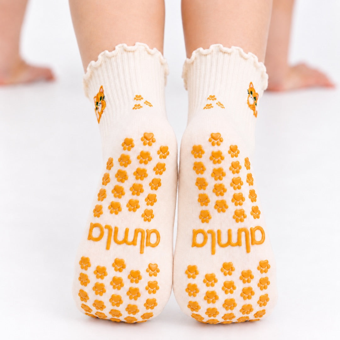 Orange Cat Grip Sock showing paw-print grips