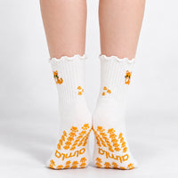 Orange Cat Grip Sock studio lifestyle image