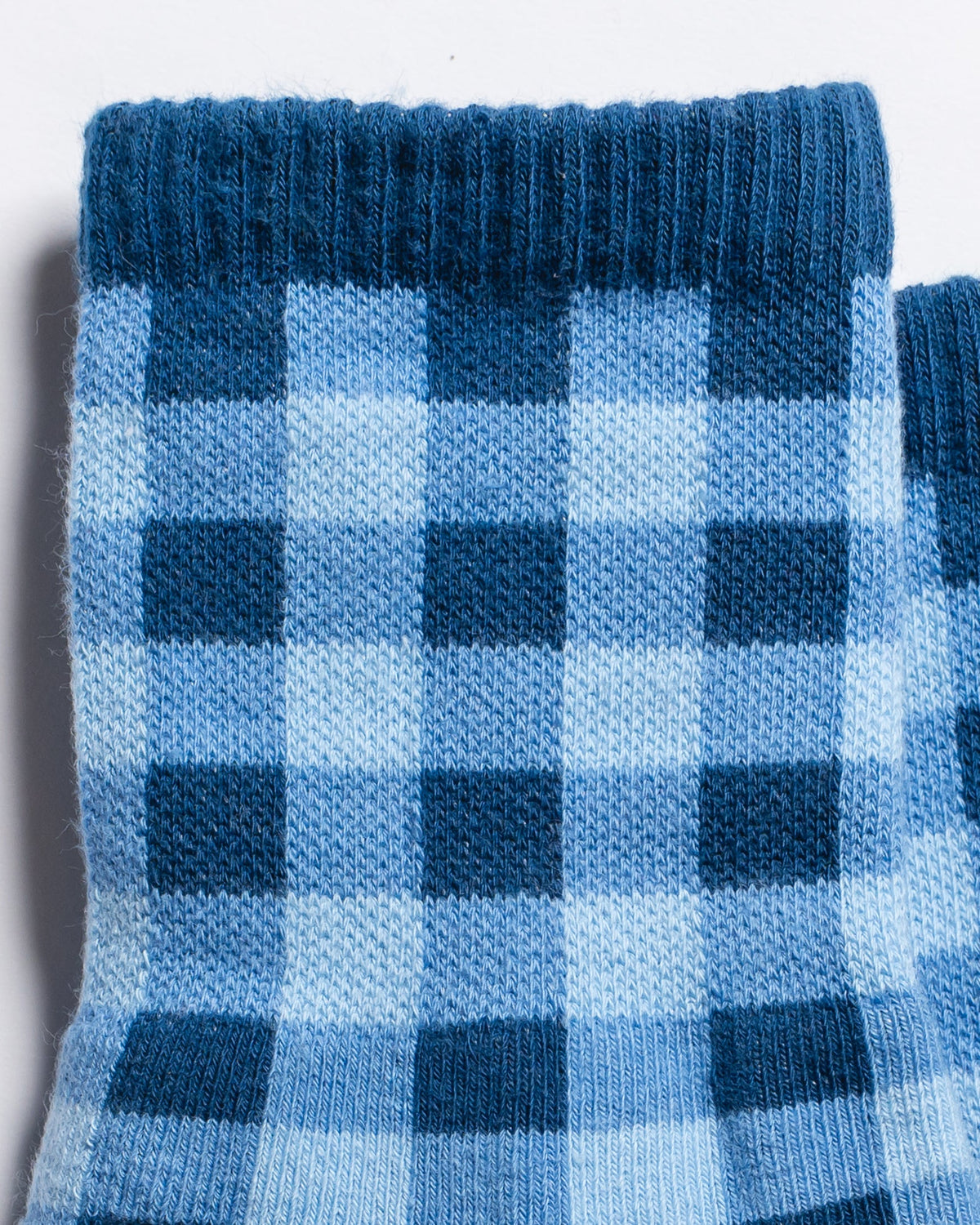 Close-up of The Prep blue gingham crew grip socks