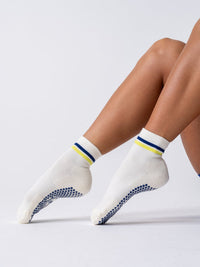 Studio Neon and Navy grip socks side view