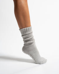 The Slouch Grey grip sock worn in a scrunched style