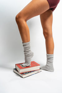 Lifestyle image of The Slouch Grey grip socks