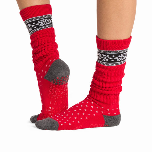 TAVI Stacy Festive slouch grip socks – red holiday pattern and sole view