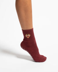 The Sweetheart burgundy crew grip socks worn with plaid heart detail