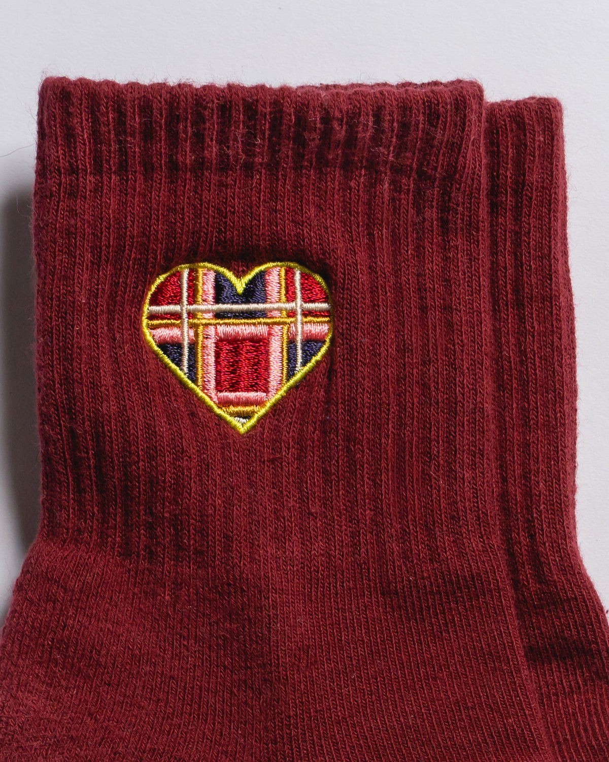 Close-up of The Sweetheart plaid heart embroidery