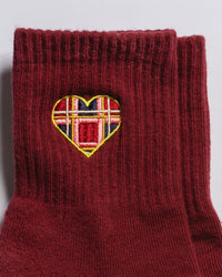 Close-up of The Sweetheart plaid heart embroidery