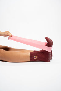Lifestyle image of The Sweetheart burgundy grip socks