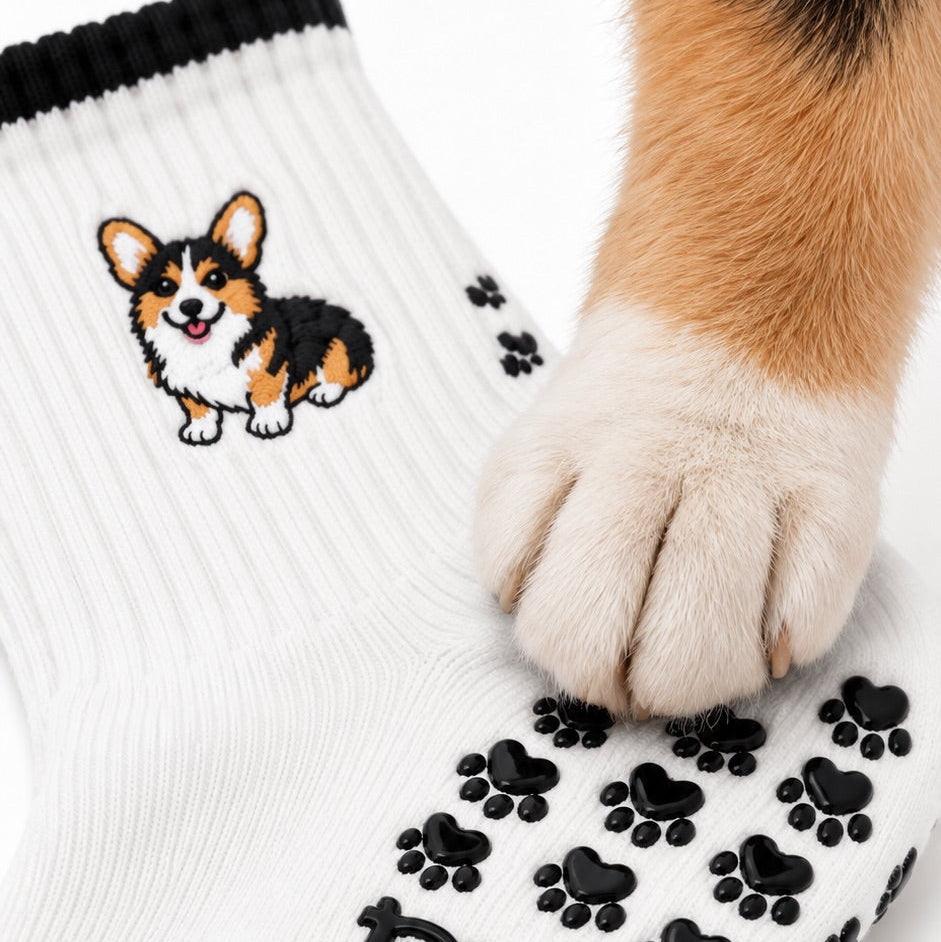 Close-up of embroidered corgi and grip details
